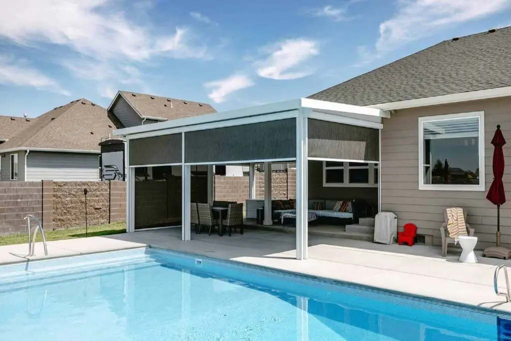 exterior screens installed beside a swimming pool Patio Covers Unlimited
