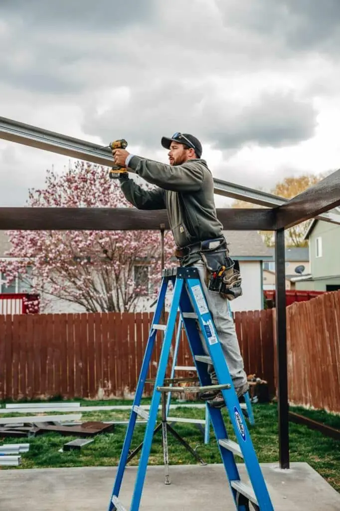 one of our skilled team doing pergola installation Patio Covers Unlimited