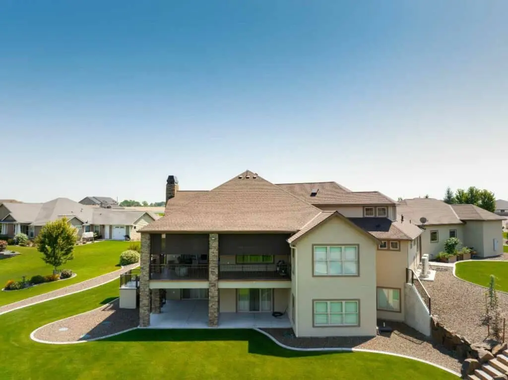 a modern home with custom patio cover designed by Patio Covers Unlimited NW