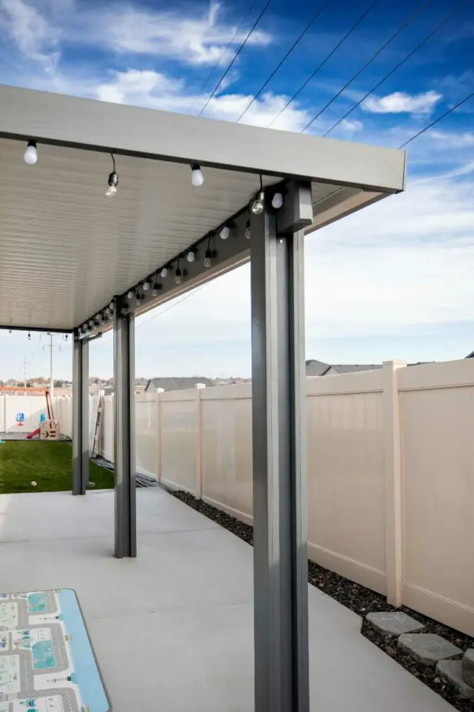 custom patio cover with lightbulbs by Patio Covers Unlimited NW