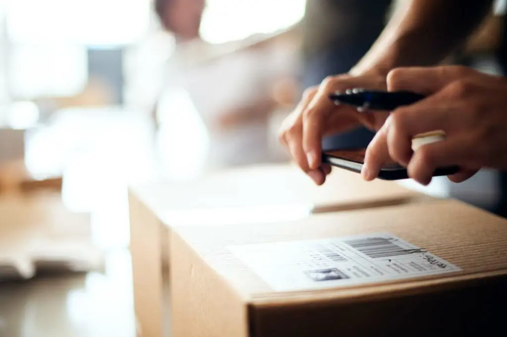 small business owner shipping out her woocommerce orders