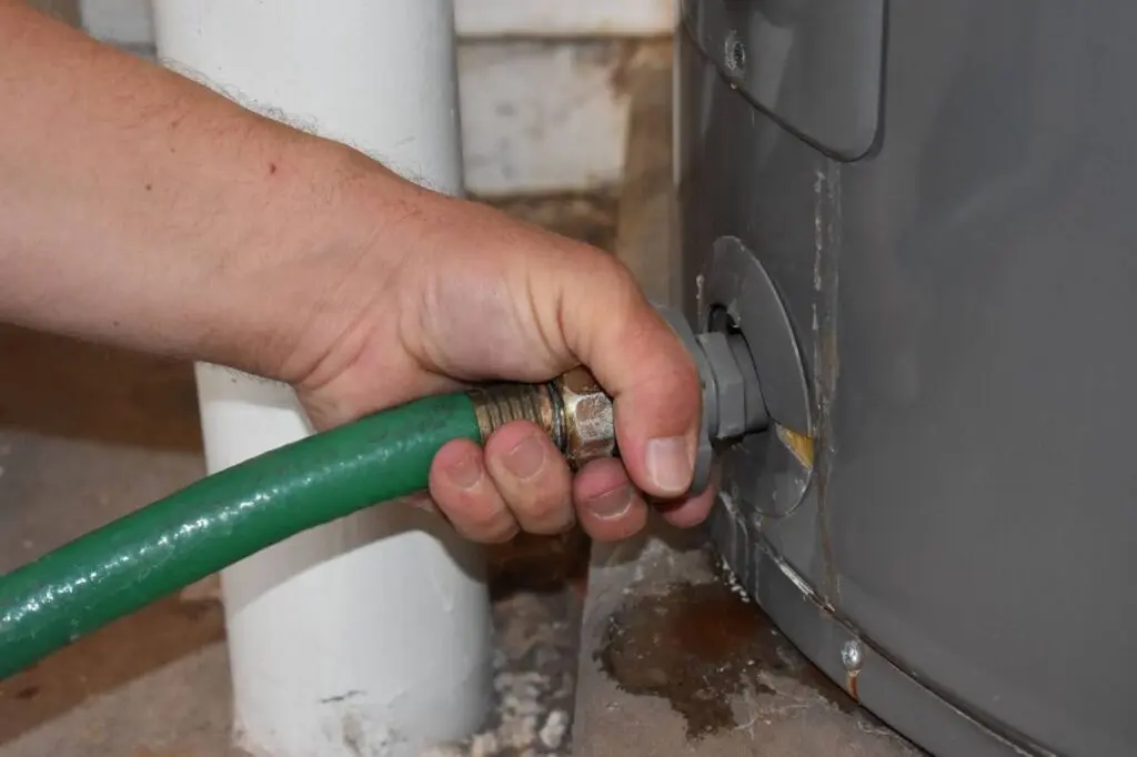 garden hose connected to flush water tank 