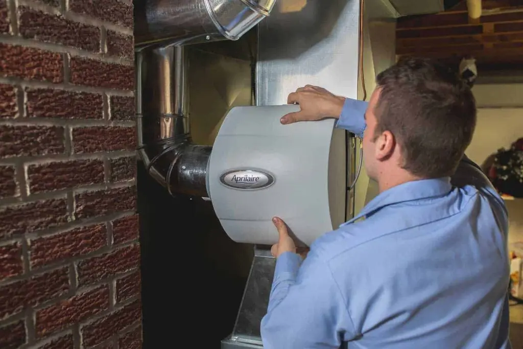 technician-repairing-whole-house-humidifier