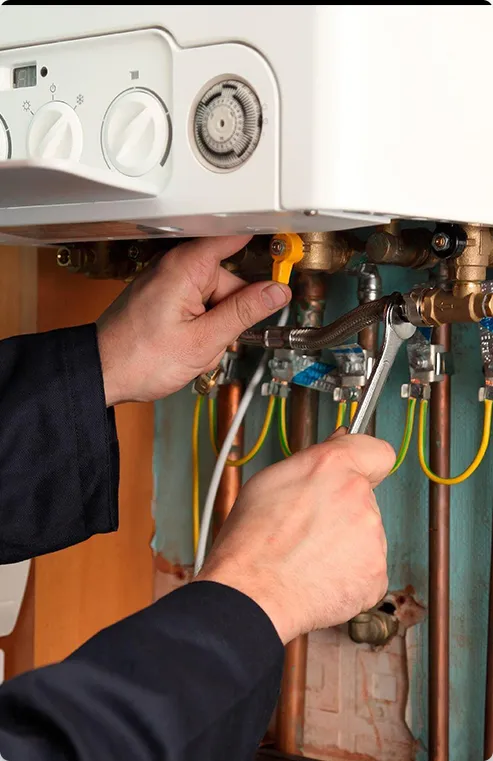 Technician working on a boiler