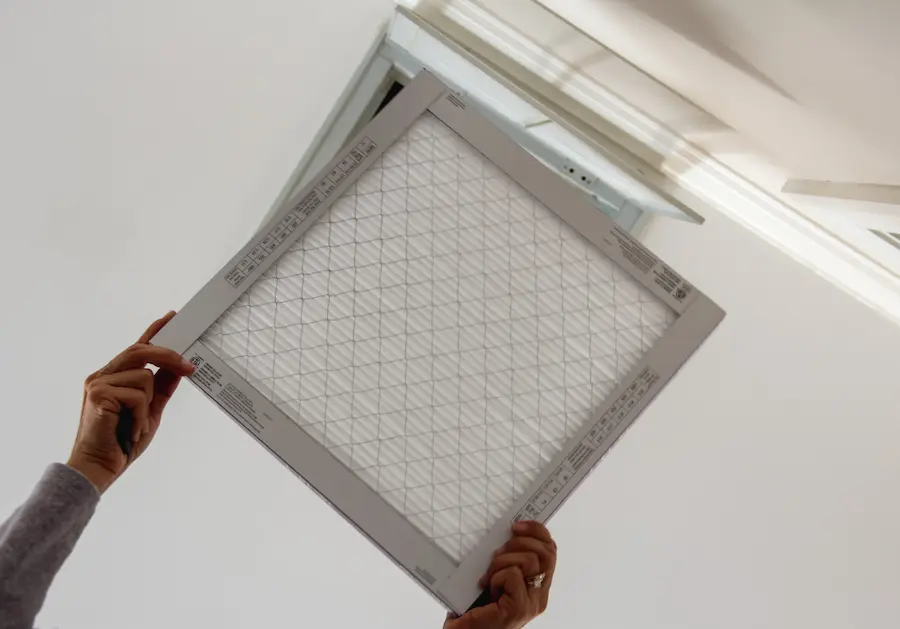 Woman changing filter ac service