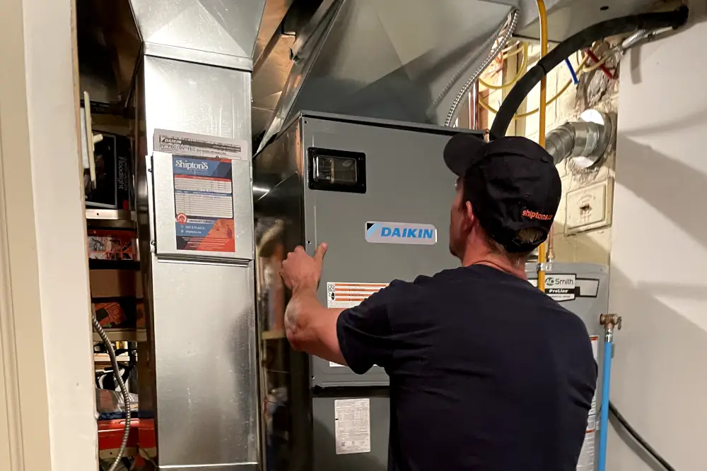 Duct Cleaning and Heat Pump Maintenance - Shipton's HVAC technician working on ducts and heat pump.