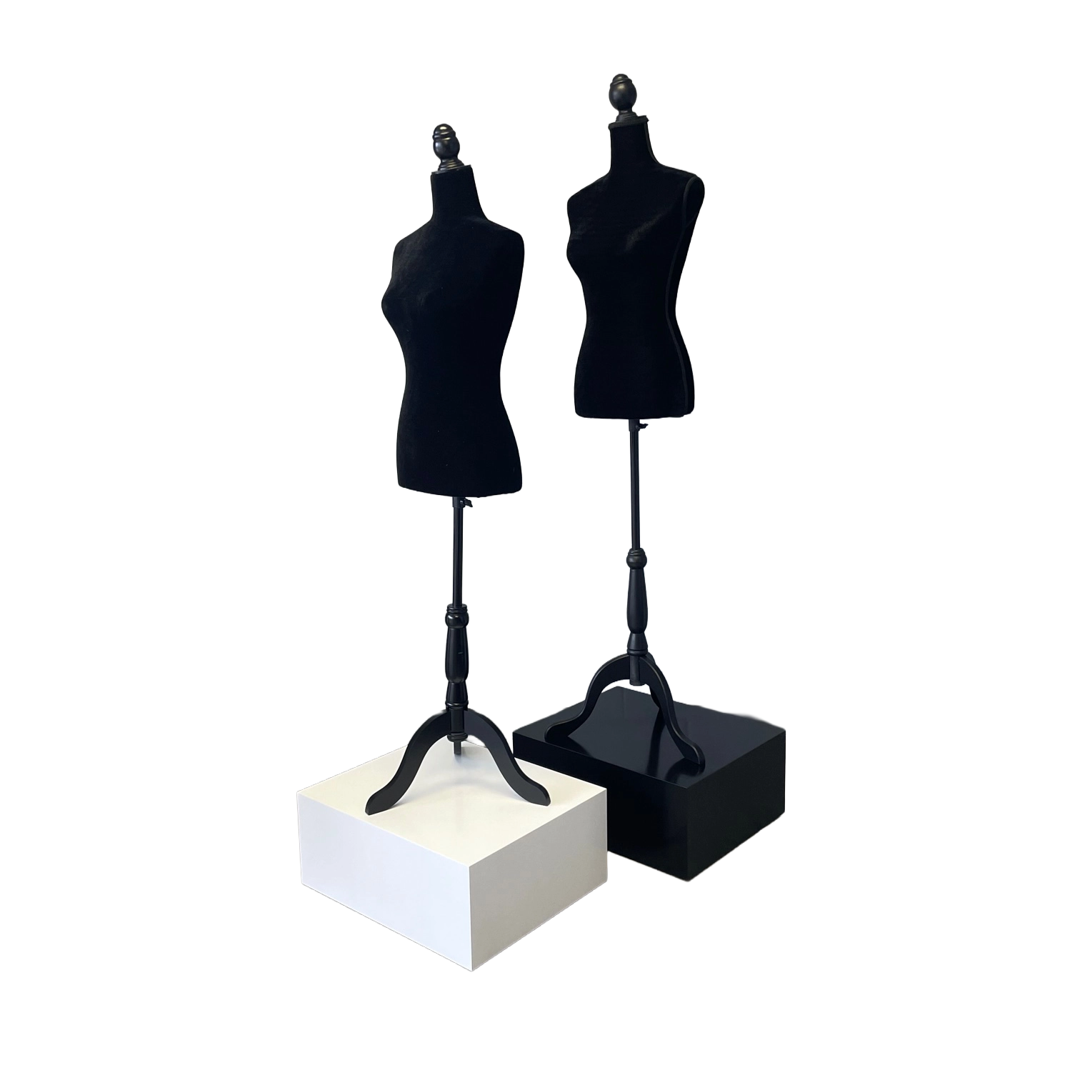 Two black mannequin busts on a white base