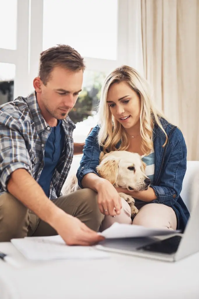 Couple with their doc looking at some financing documents
