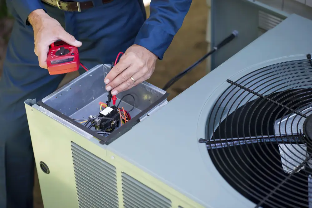 AC Maintenance being doing by an HVAC technician.