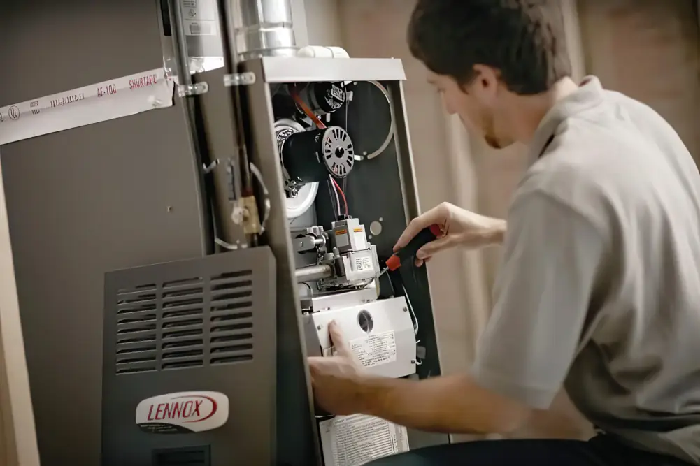 Furnace Installation in London, Ontario - Technician installing a furnace