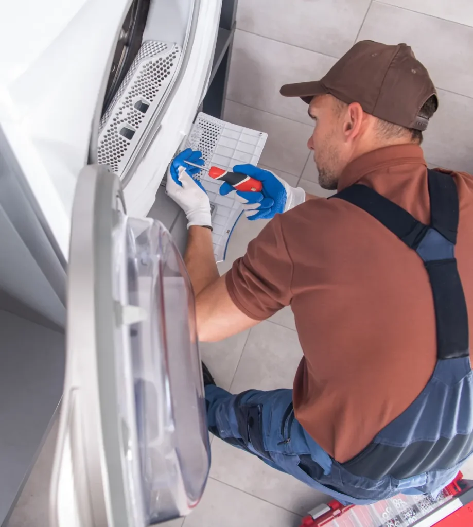 Technician fixing a dryer
