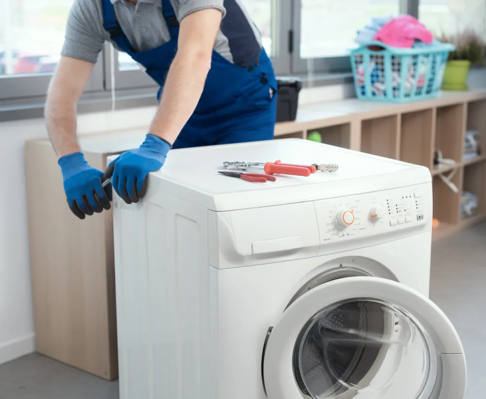Washer Repair Services in London ON - Professional repairman fixing a washer