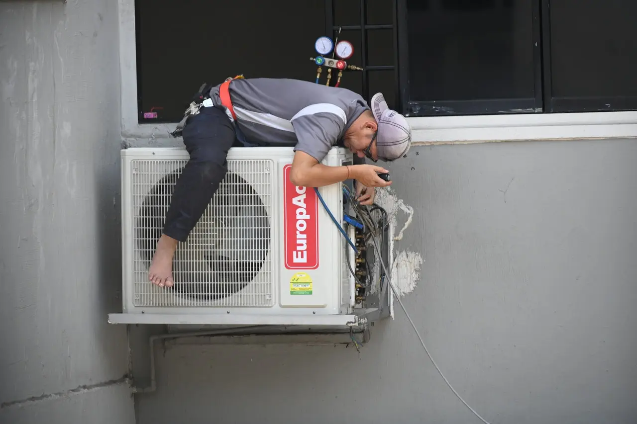 servicing an air conditioner