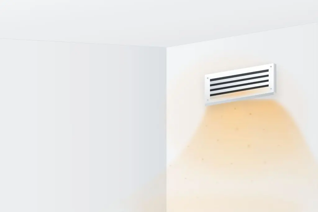 Warm air and dust blowing from a home supply vent, the usual cause of a furnace burning smell