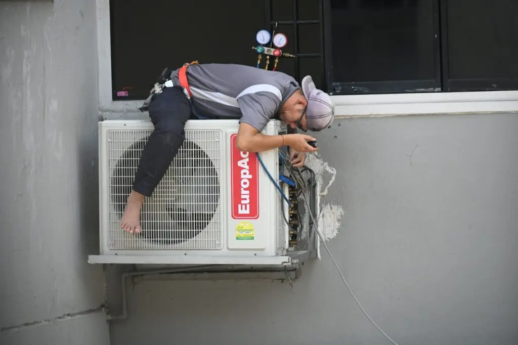 servicing an air conditioner