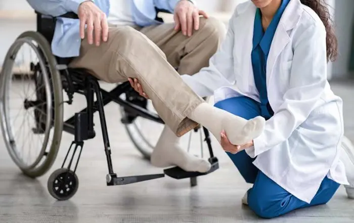 Personal injury lawyer helping a client understand the legal, medical, and financial steps to take after being paralyzed in a car accident | What to Do After Being Paralyzed in a Car Accident