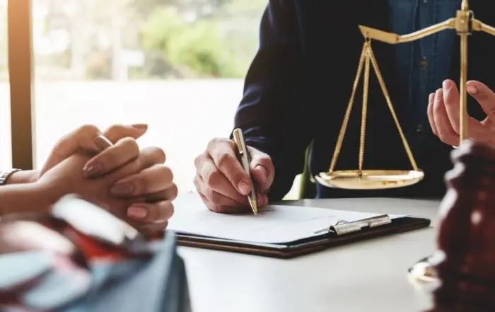 Parent meeting with a personal injury attorney to discuss filing a legal claim on behalf of an injured child | Filing a Personal Injury Claim on Behalf of a Child