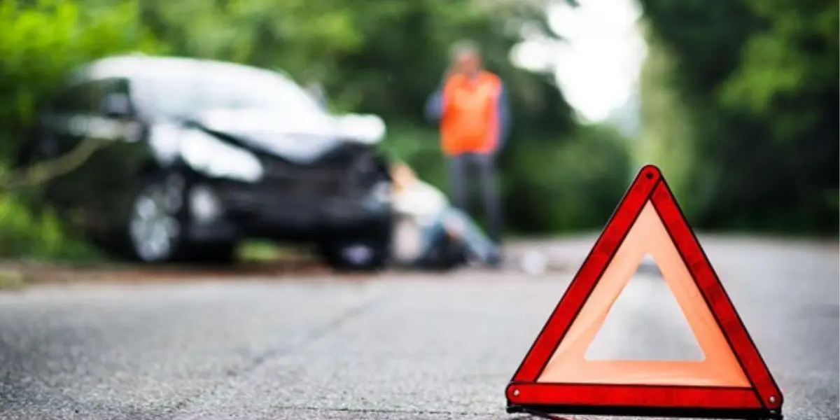 Damaged vehicle stopped after striking a road hazard while a personal injury attorney reviews liability options with the driver | Who Is Liable if a Road Hazard Causes a Car Accident?