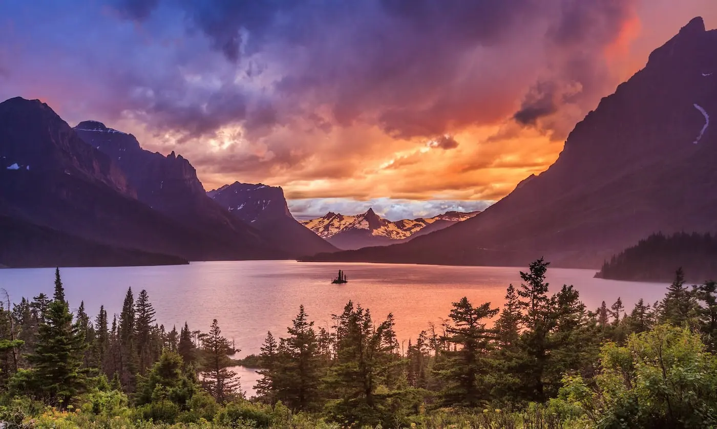 Brava roofing contractors in Montana - Image of a scenic lake and mountain view during a Montana sunset