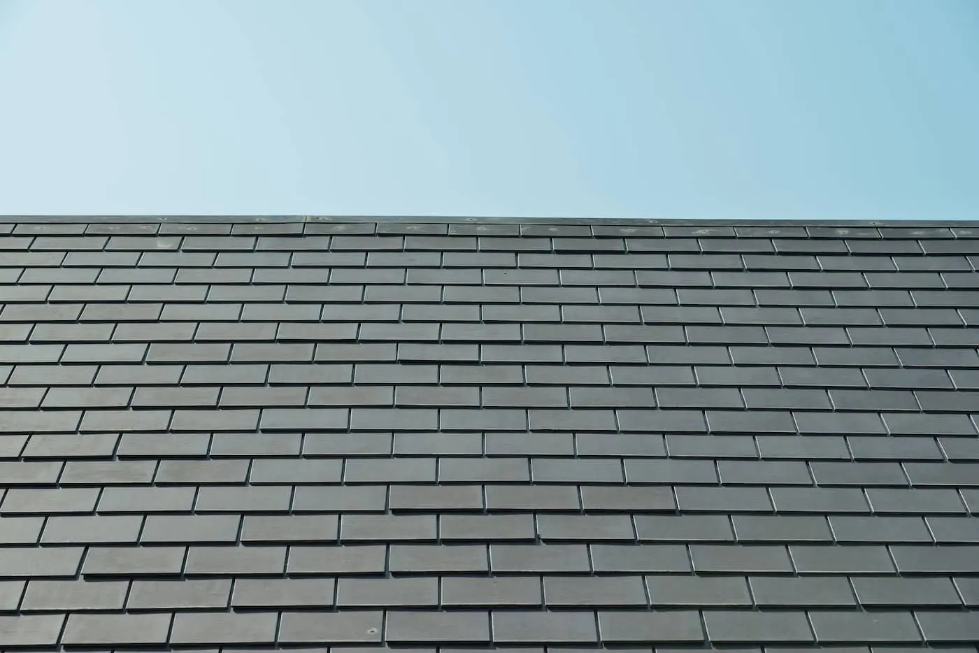 horizontal picture of slates on a roof: brava vs davinci