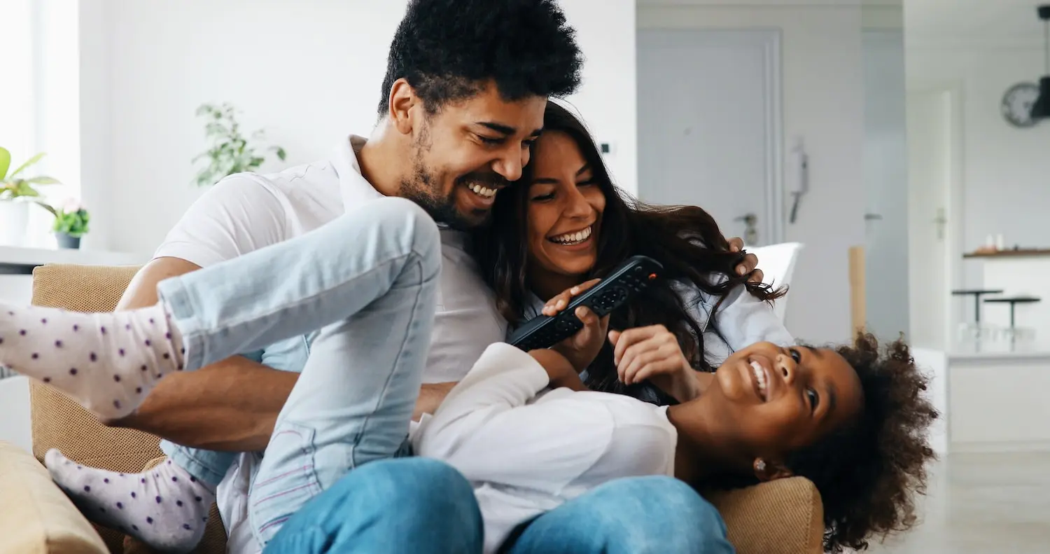 happy family having fun time together at home after storm damage is repaired