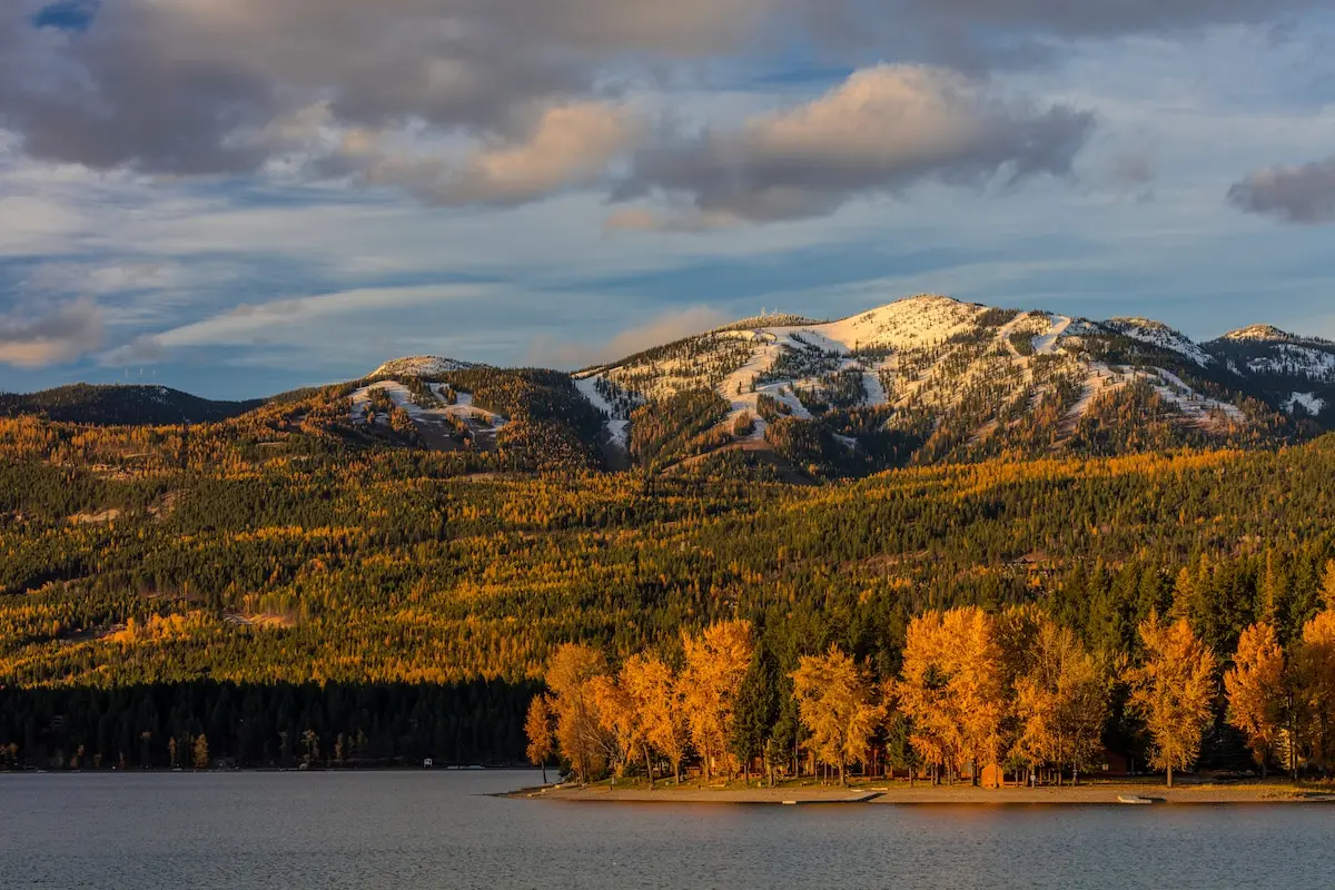 Evening light at city beach in autumn along Whitefish Lake in Whitefish, Montana, USA
