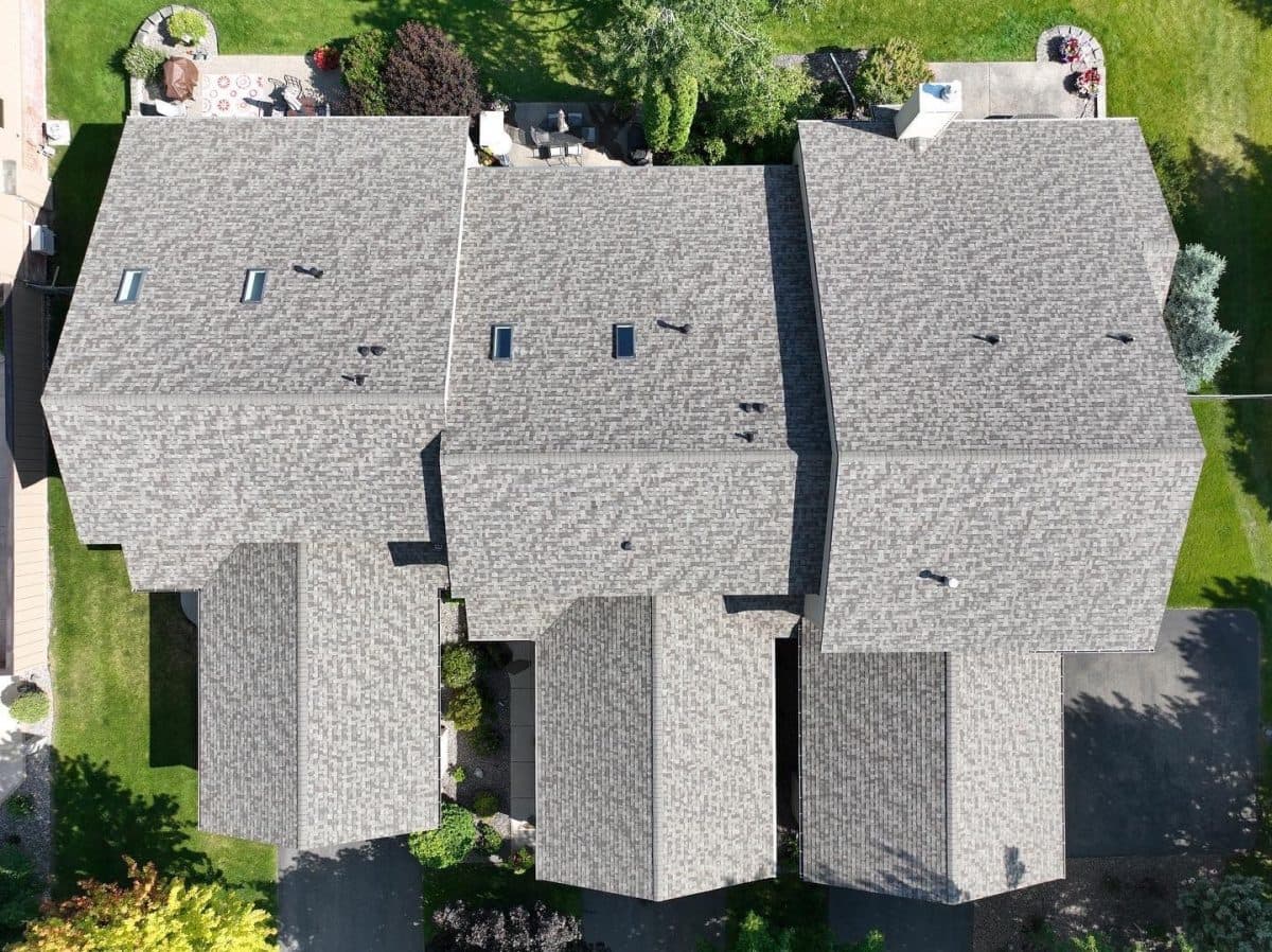aerial view of big shingles roof huge house
