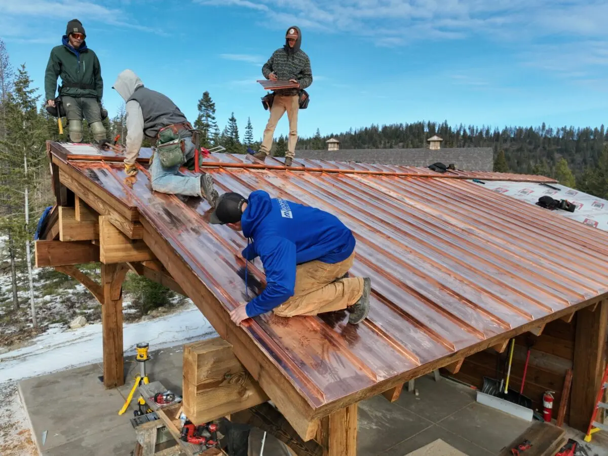 montana workers replacing metallic roof