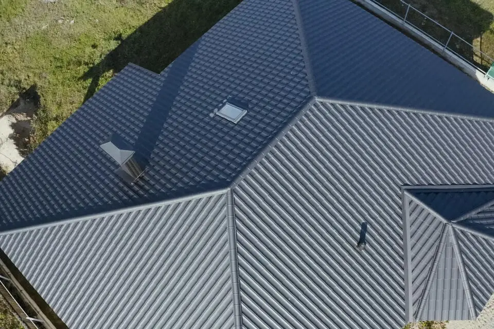 aerial view of a gray metal roof on a large home