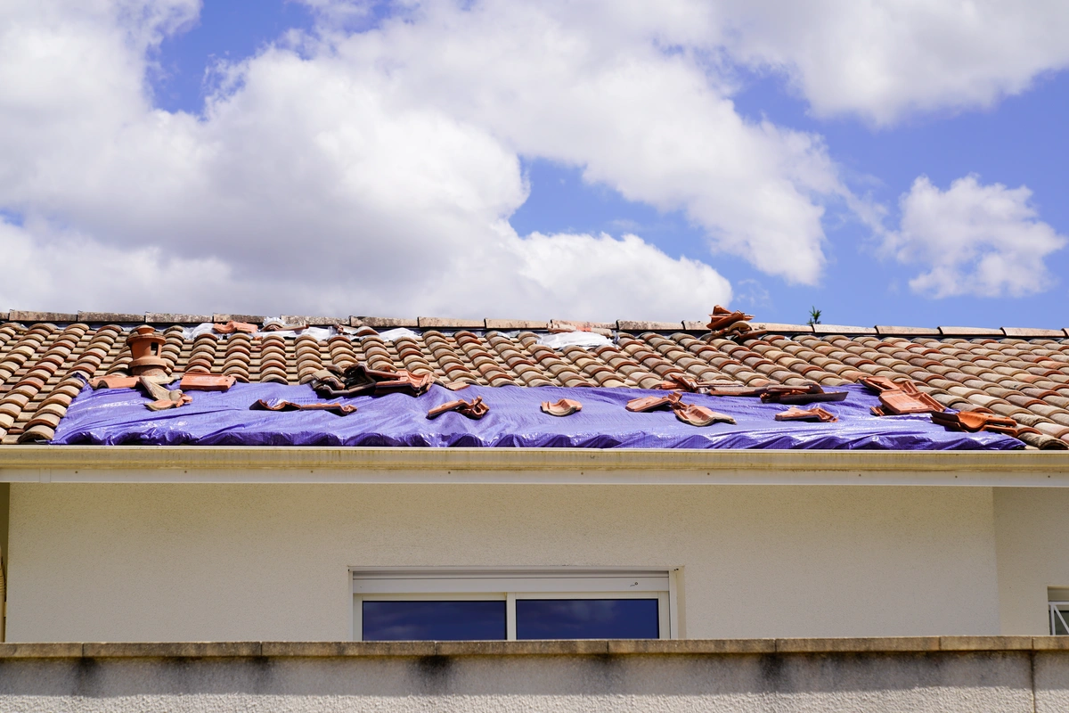 damaged roof covered for repair process