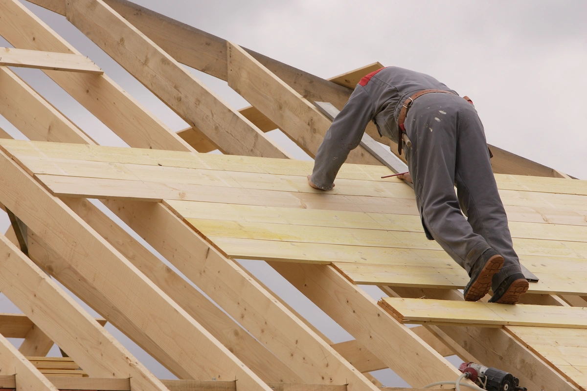 professional roofer building the wood structure