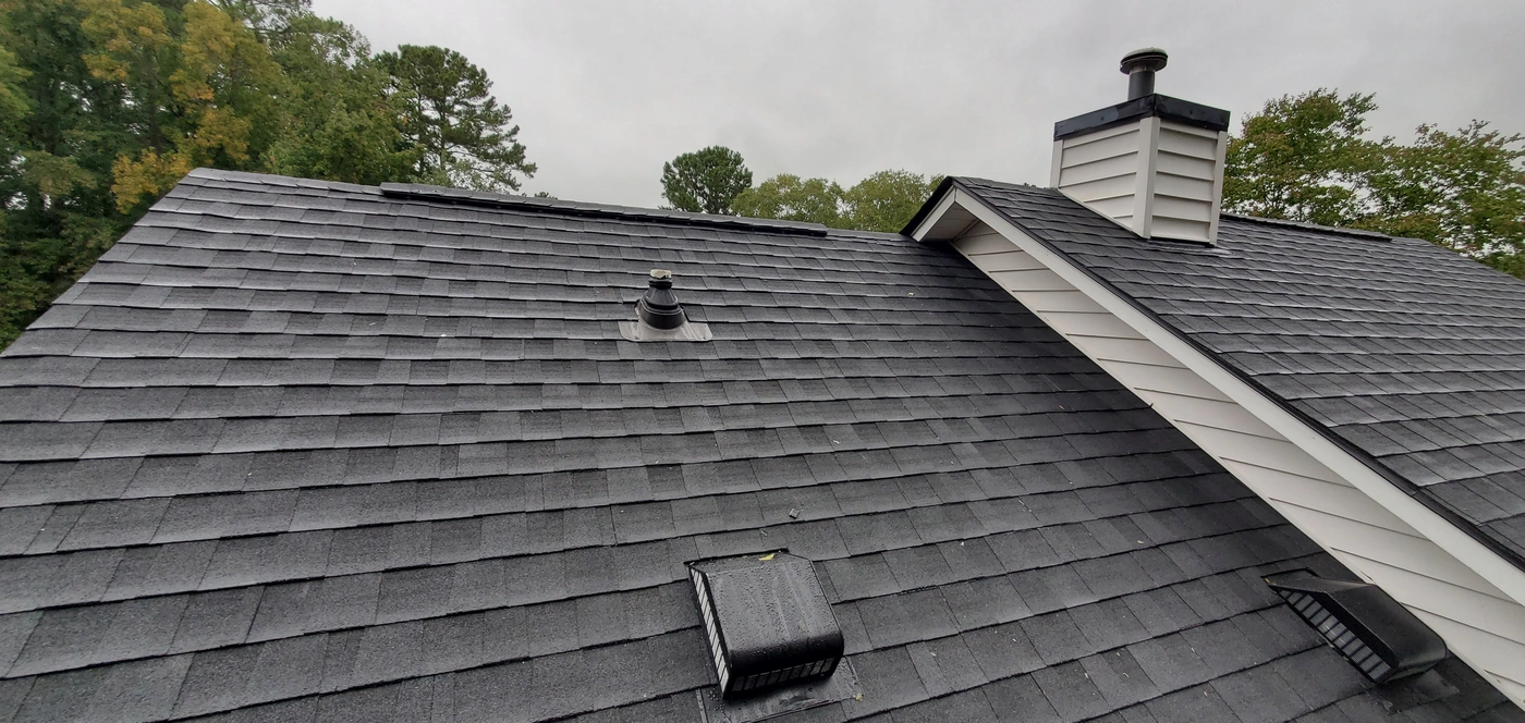 close up of dark grey gaf roofing shingles installed on home in evergreen mt