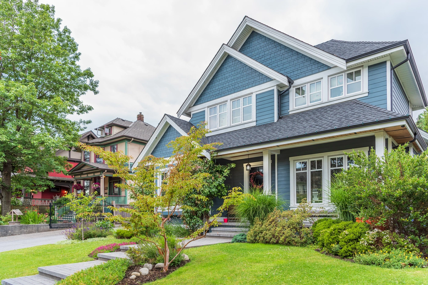 asphalt shingle roofing with GAF shingle installation on home with blue siding