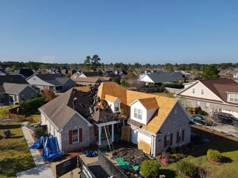 Summit team working on replacing a roof