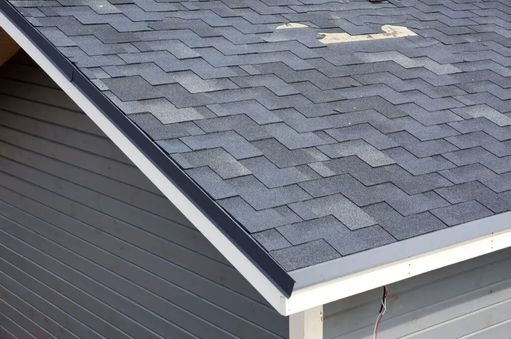 roof repair cost blue shingle missing