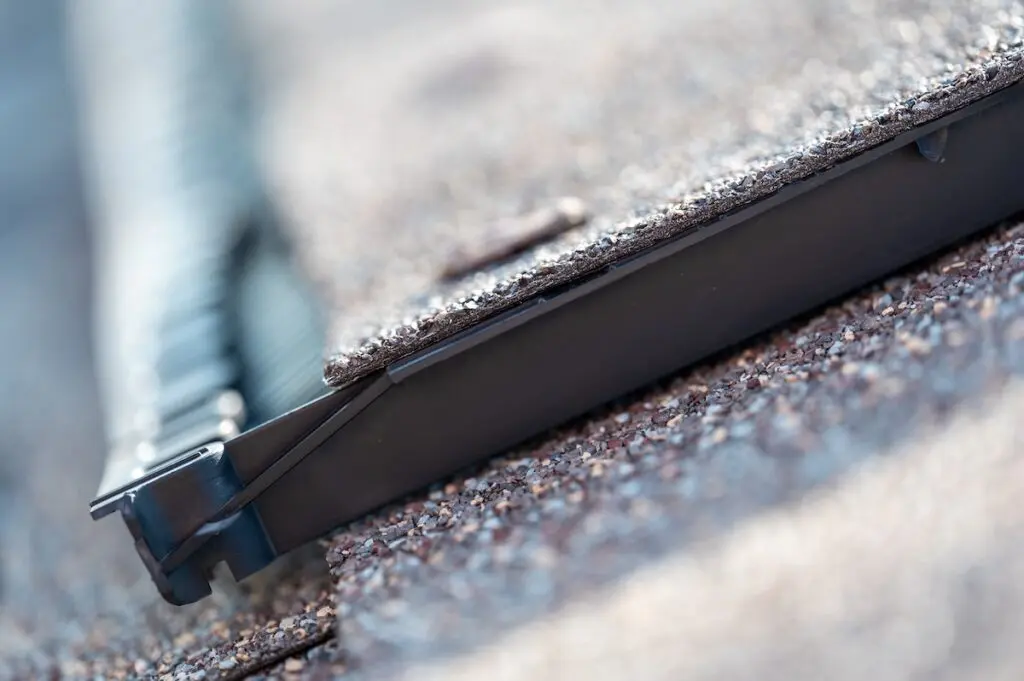 typical Ridge cap vent installed on a shingle roof for passive attic ventilation