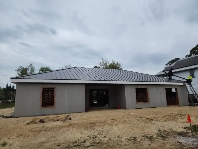 low slope roof grey shingles roof house under construction