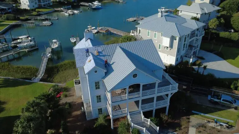 commercial roof installation metallic roof house next to the sea