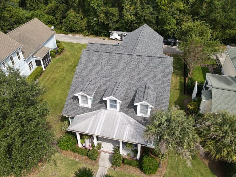 aerial view of big house with shingles roof