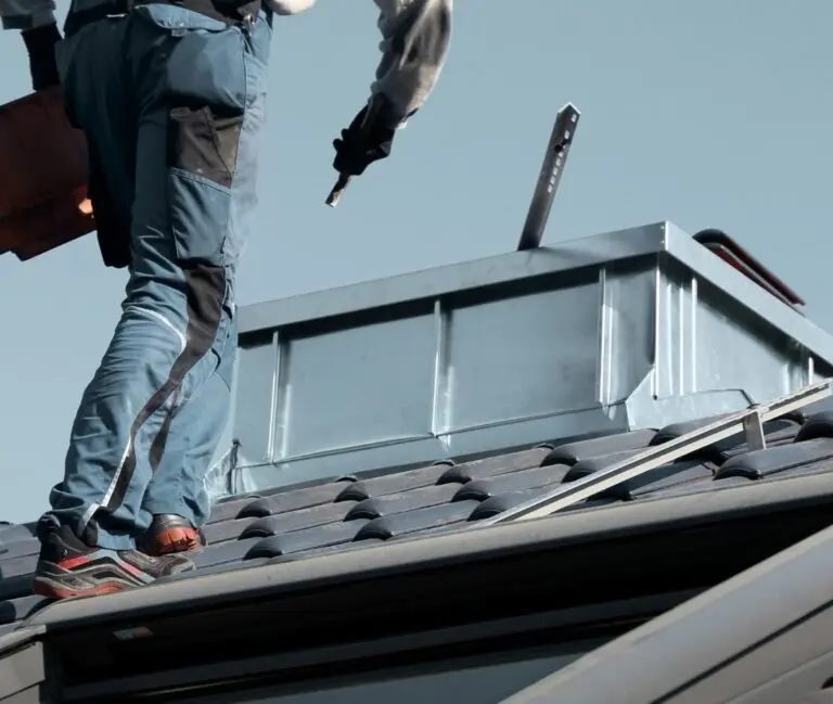 Summit Roofing team member on a roof