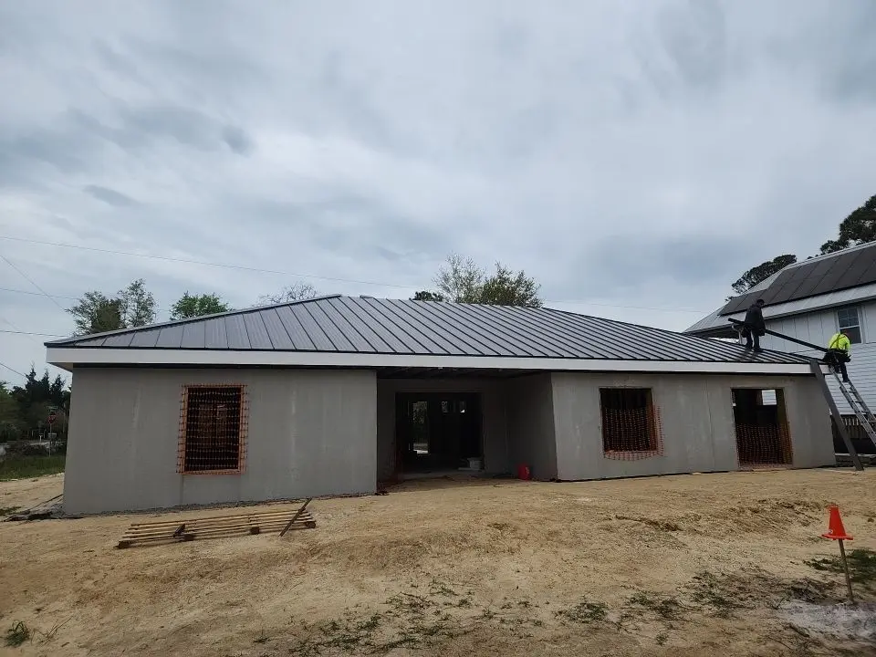 low slope roof grey shingles roof house under construction