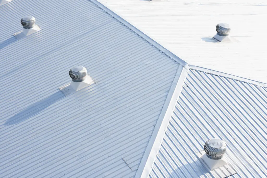 metal sheet roofing on commercial construction with blue sky