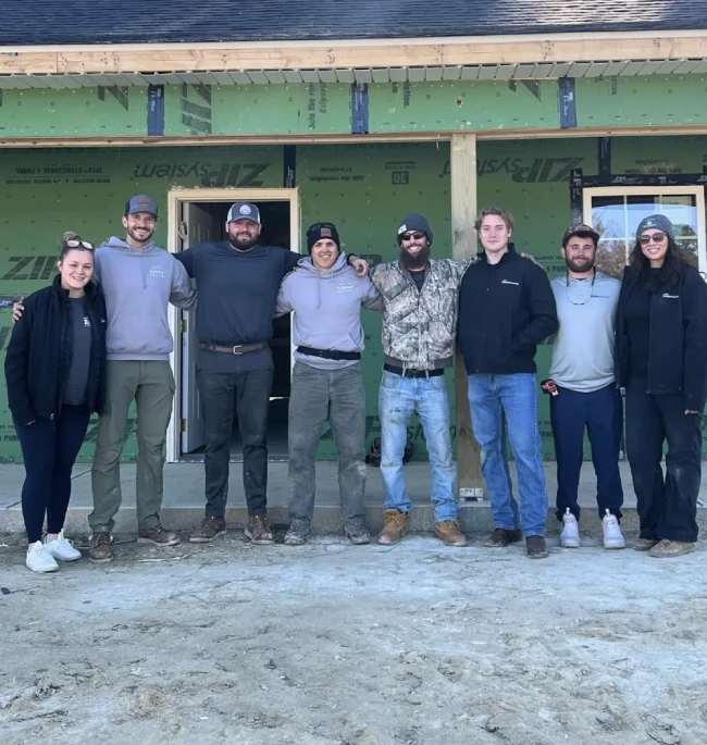 Summit Roofing team photo at a jobsite