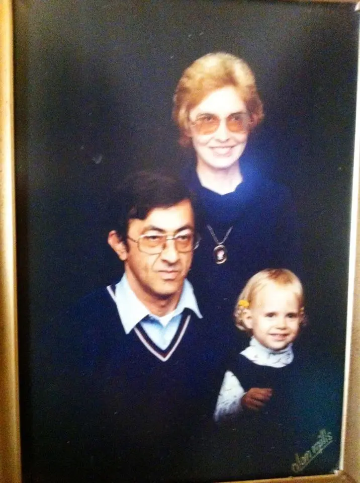 studio portrait of family of three