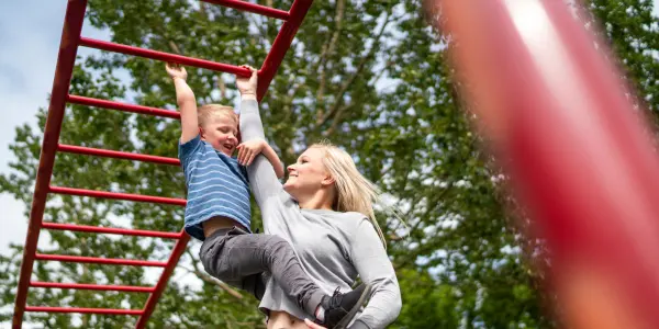 Mom on monkey bars