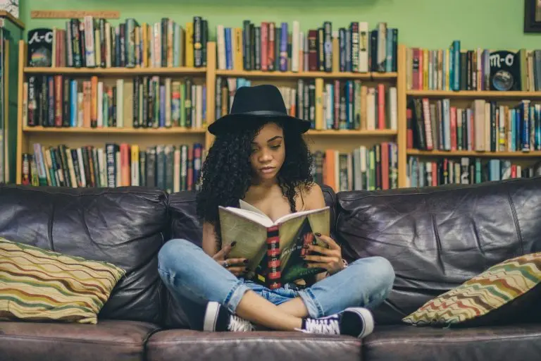 girl reading on a couch
