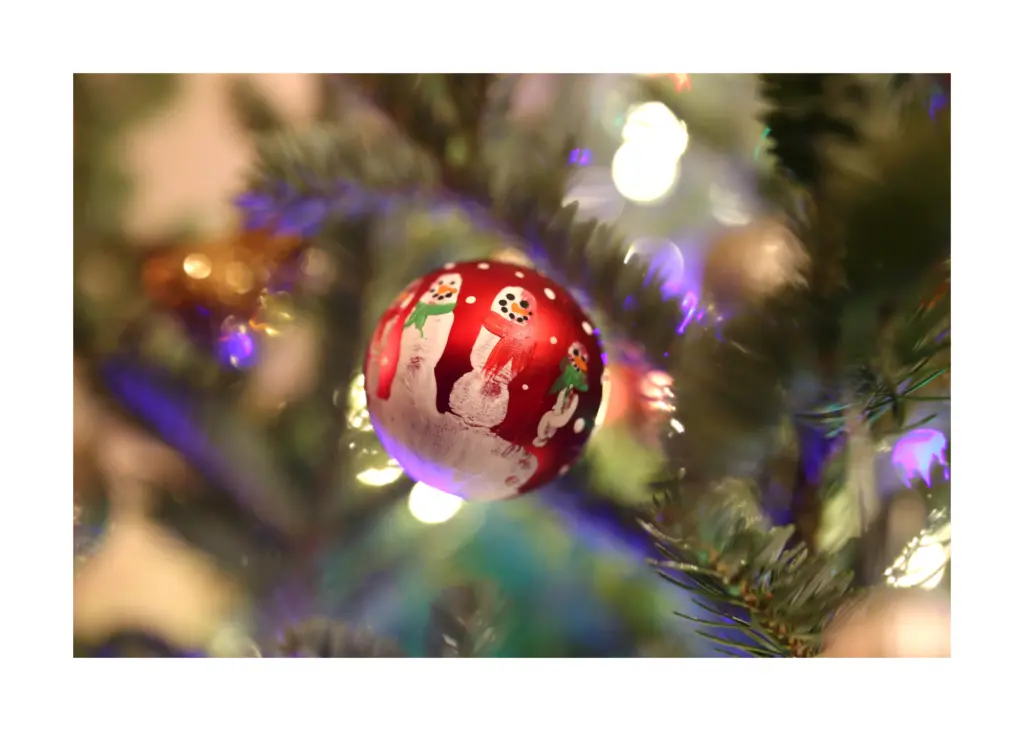 kids homemade hand-print ornament to simplify gift-giving