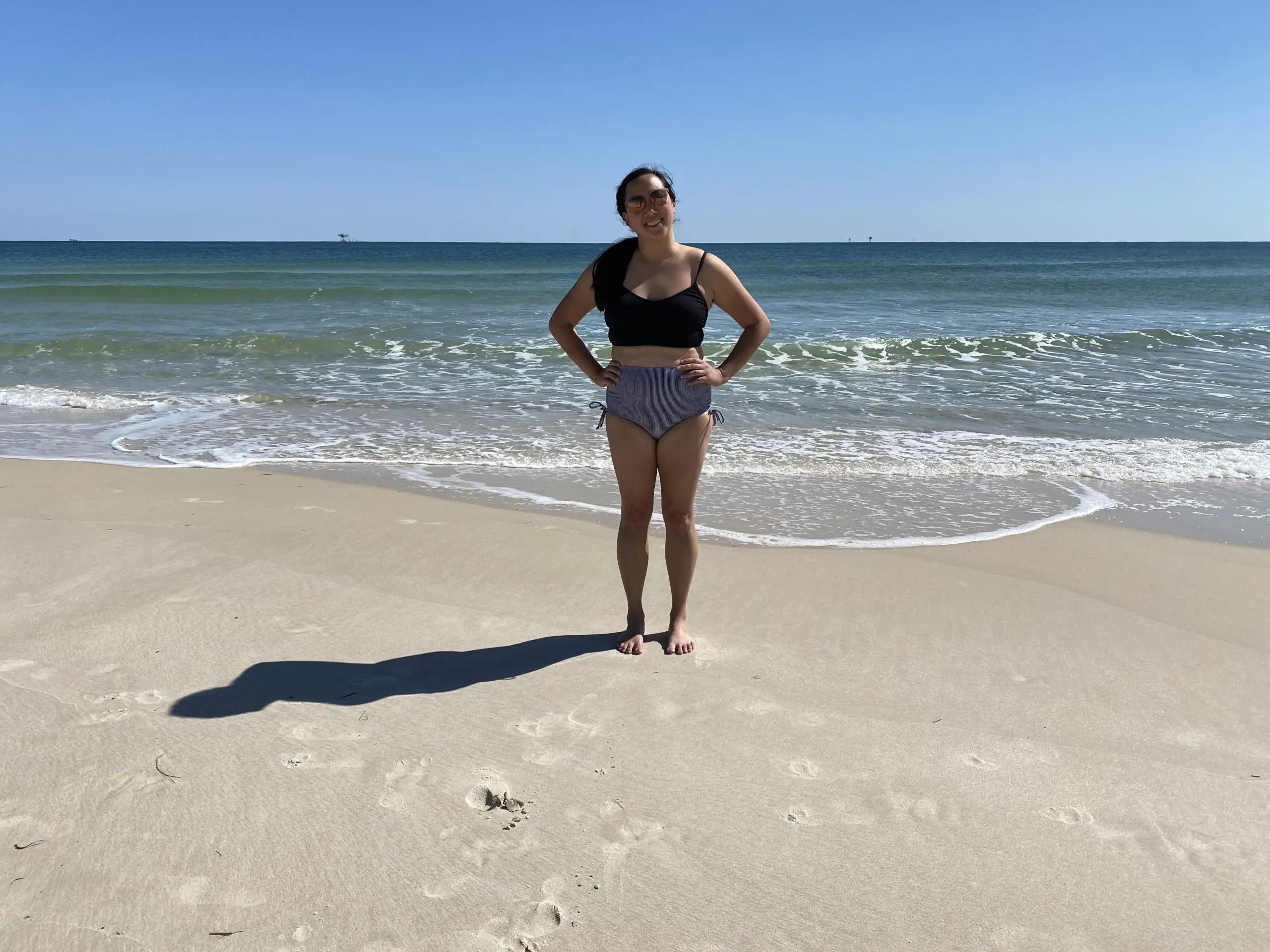 Author in her bikini at the beach