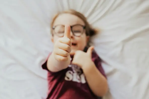wobbling kid thumbs up
