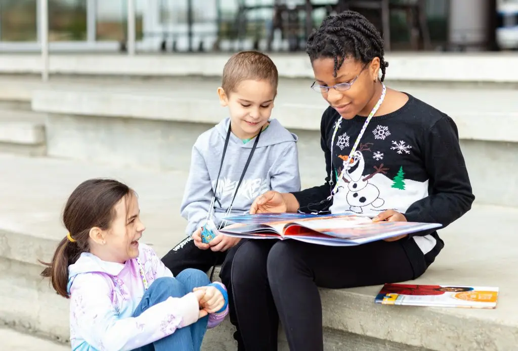 children reading books together